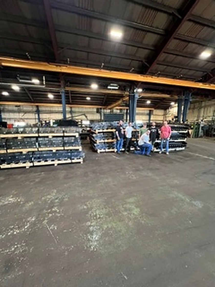 The completed 367-foot steel belt staged on the Transcon shop floor before shipping